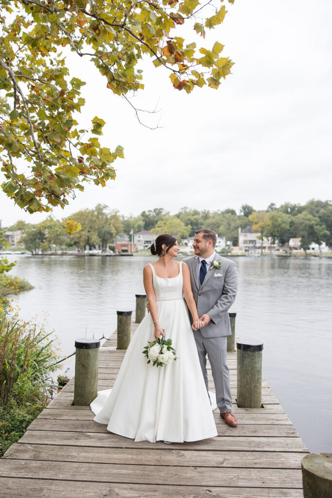 bride and groom in front of Occoquan river